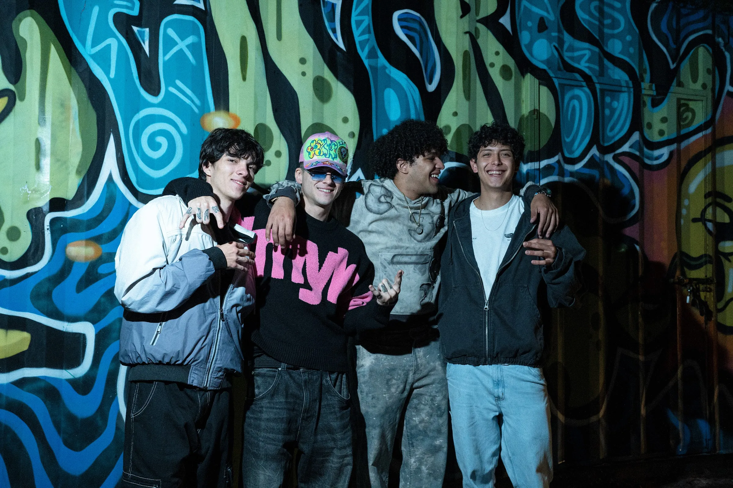The Central Sun crew in front of a mural